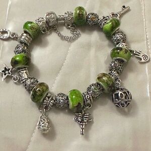 Handmade – NWOT – 925 SS plated charm bracelet, 8 green beads, variety of charms